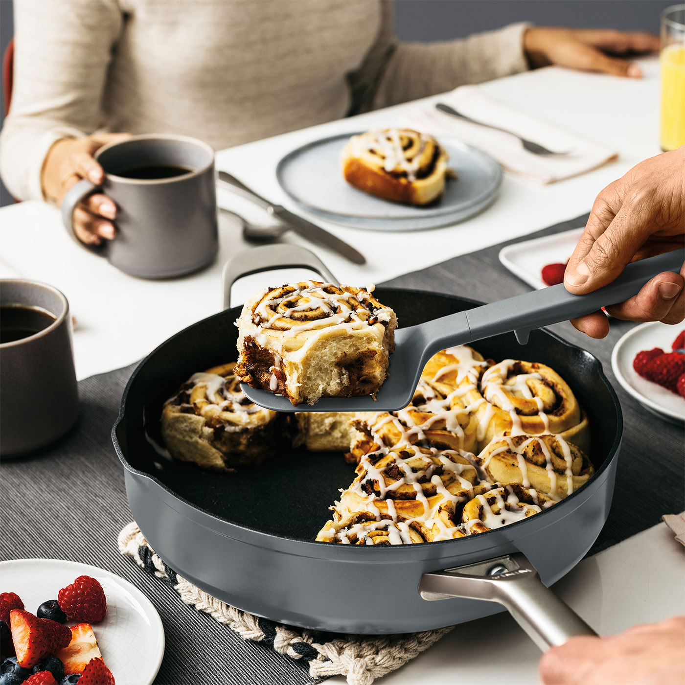 Image of Cinnamon rolls being served from a Ninja pan at a breakfast table.